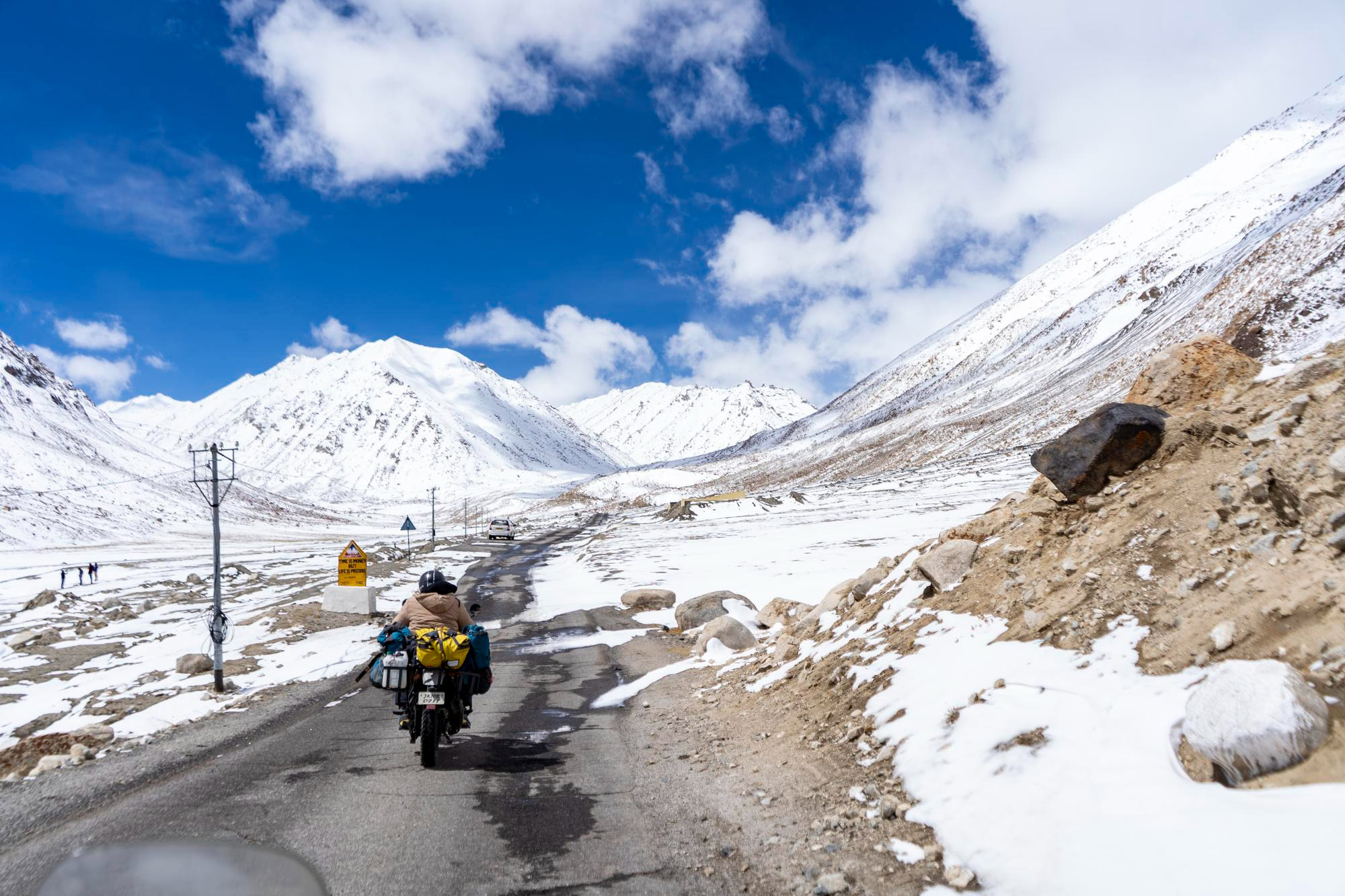 indian-biker-riding-bike-through-world-highest-motorable-road-khardungla-pass-ladakh 7